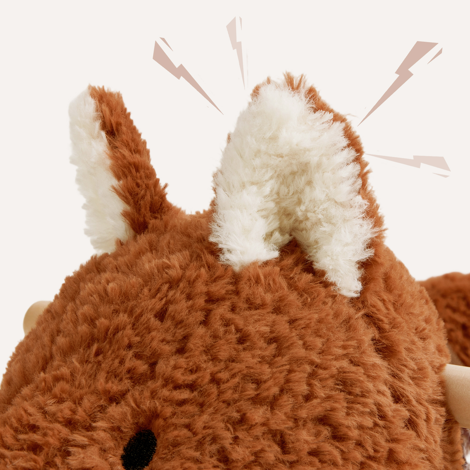 Close-up of fox plush rocker ears with soft rust and white fabric